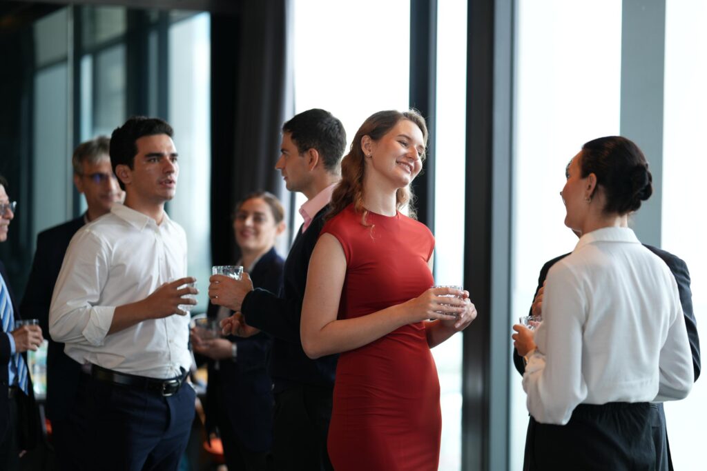 Guests talking at an evening event inside Plein Publiek BXL